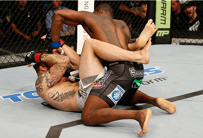 BOSTON, MA - AUGUST 17: (R-L) Ovince Saint Preux punches Cody Donovan in their UFC light heavyweight bout at TD Garden on August 17, 2013 in Boston, Massachusetts. (Photo by Josh Hedges/Zuffa LLC/Zuffa LLC via Getty Images)