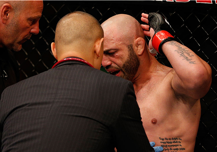 BOSTON, MA - AUGUST 17: Manny Gamburyan complains about an illegal elbow suffered in his UFC featherweight bout against Cole Miller at TD Garden on August 17, 2013 in Boston, Massachusetts. (Photo by Josh Hedges/Zuffa LLC/Zuffa LLC via Getty Images)