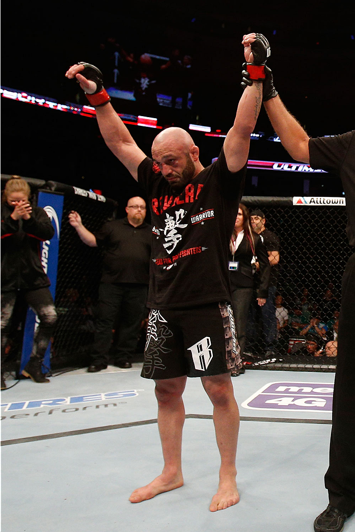 BOSTON, MA - AUGUST 17:  Manny Gamburyan reacts after his decision victory over Cole Miller in their UFC featherweight bout at TD Garden on August 17, 2013 in Boston, Massachusetts. (Photo by Josh Hedges/Zuffa LLC/Zuffa LLC via Getty Images)