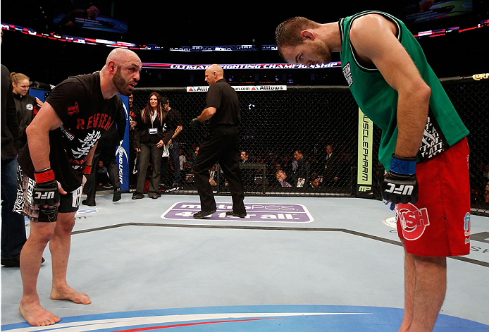 BOSTON, MA - AUGUST 17: (L-R) Manny Gamburyan and Cole Miller bow to each ofter after their UFC featherweight bout at TD Garden on August 17, 2013 in Boston, Massachusetts. (Photo by Josh Hedges/Zuffa LLC/Zuffa LLC via Getty Images)