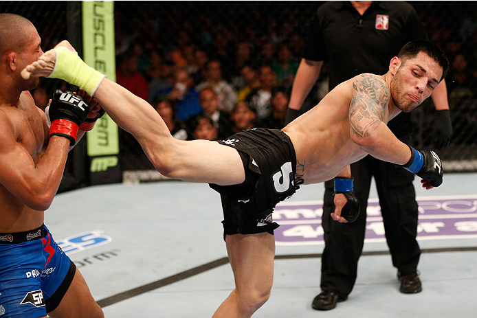 BOSTON, MA - AUGUST 17:  (R-L) Daniel Pineda kicks Diego Brandao in their UFC featherweight bout at TD Garden on August 17, 2013 in Boston, Massachusetts. (Photo by Josh Hedges/Zuffa LLC/Zuffa LLC via Getty Images)