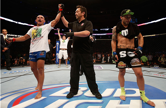 BOSTON, MA - AUGUST 17:  Diego Brandao (L) reacts after his decision victory over Daniel Pineda in their UFC featherweight bout at TD Garden on August 17, 2013 in Boston, Massachusetts. (Photo by Josh Hedges/Zuffa LLC/Zuffa LLC via Getty Images)