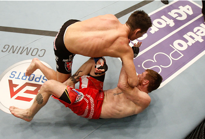 BOSTON, MA - AUGUST 17:  (L-R) Steven Siler knocks out Mike Brown with a series of punches on the ground in their UFC featherweight bout at TD Garden on August 17, 2013 in Boston, Massachusetts. (Photo by Josh Hedges/Zuffa LLC/Zuffa LLC via Getty Images)