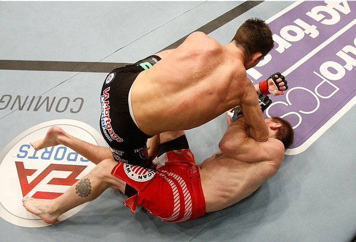 BOSTON, MA - AUGUST 17:  (L-R) Steven Siler knocks out Mike Brown with a series of punches on the ground in their UFC featherweight bout at TD Garden on August 17, 2013 in Boston, Massachusetts. (Photo by Josh Hedges/Zuffa LLC/Zuffa LLC via Getty Images)