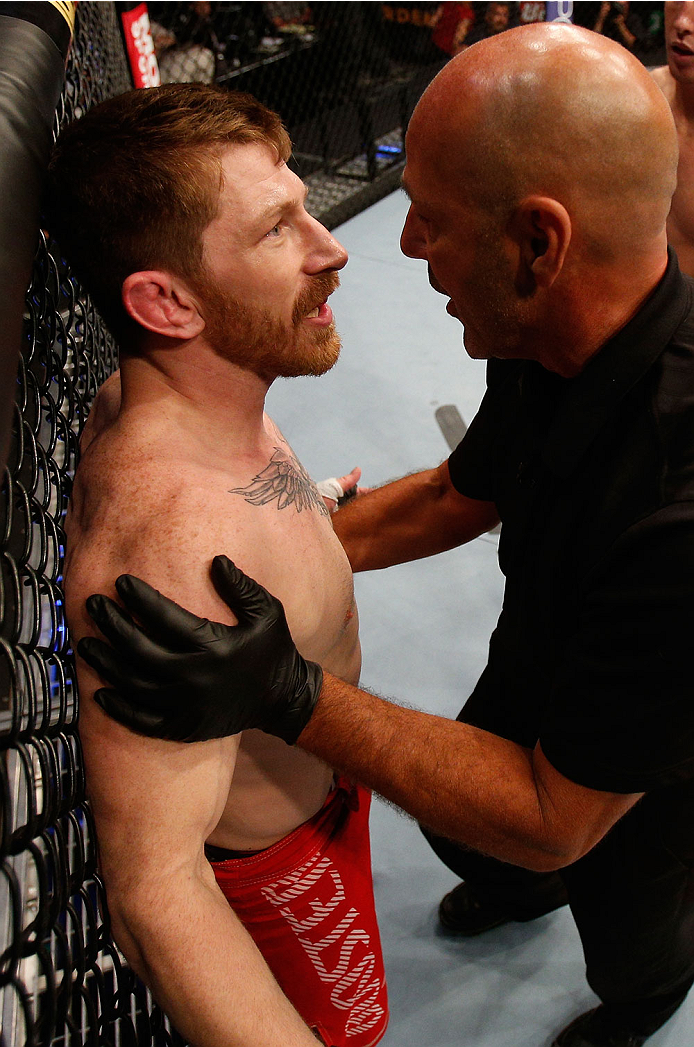 BOSTON, MA - AUGUST 17: (L-R) Mike Brown protests to referee Yves Lavigne after his knockout loss to Steven Siler in their UFC featherweight bout at TD Garden on August 17, 2013 in Boston, Massachusetts. (Photo by Josh Hedges/Zuffa LLC/Zuffa LLC via Gett