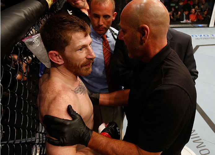 BOSTON, MA - AUGUST 17: (L-R) Mike Brown protests to referee Yves Lavigne after his knockout loss to Steven Siler in their UFC featherweight bout at TD Garden on August 17, 2013 in Boston, Massachusetts. (Photo by Josh Hedges/Zuffa LLC/Zuffa LLC via Gett