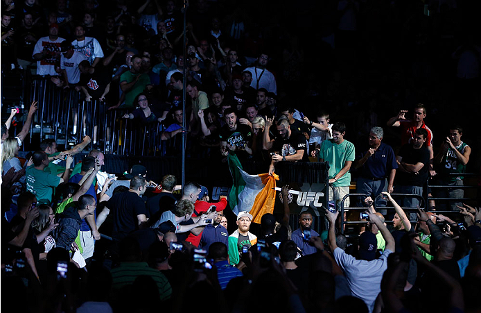 BOSTON, MA - AUGUST 17:  Conor McGregor enters the arena before his UFC featherweight bout against Max Holloway at TD Garden on August 17, 2013 in Boston, Massachusetts. (Photo by Josh Hedges/Zuffa LLC/Zuffa LLC via Getty Images)