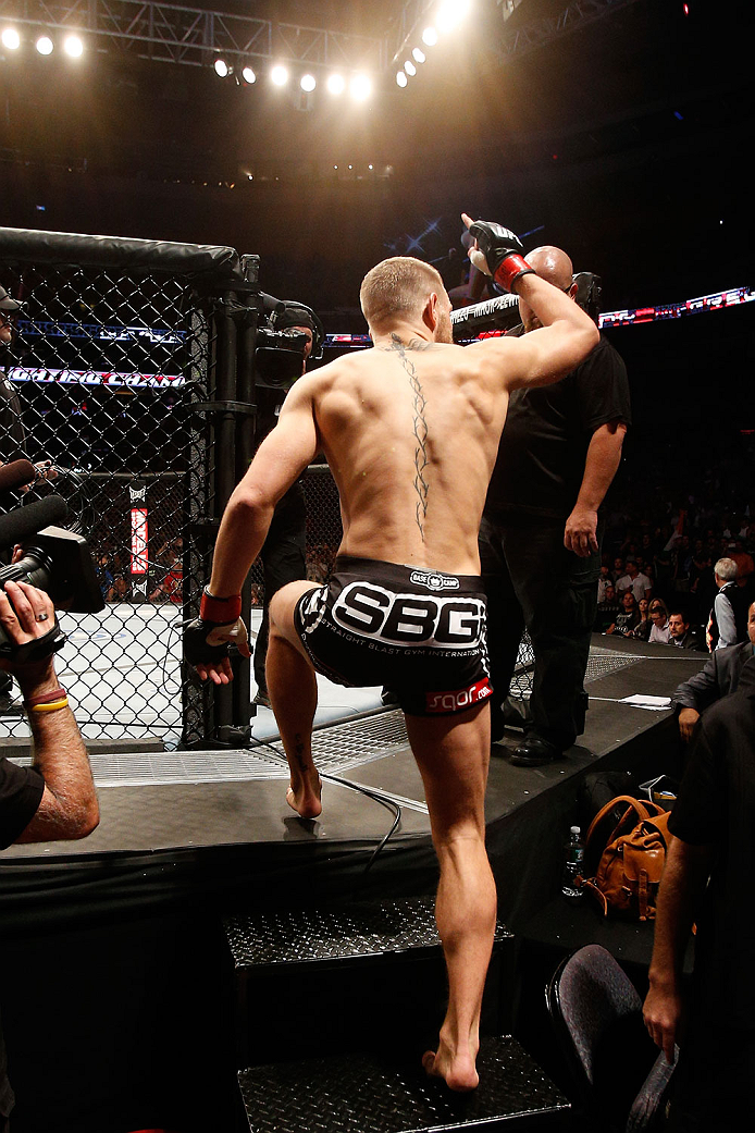 BOSTON, MA - AUGUST 17: Conor McGregor enters the Octagon before his UFC featherweight bout against Max Holloway at TD Garden on August 17, 2013 in Boston, Massachusetts. (Photo by Josh Hedges/Zuffa LLC/Zuffa LLC via Getty Images)