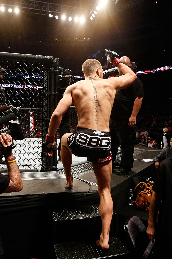 BOSTON, MA - AUGUST 17:  Conor McGregor enters the Octagon before his UFC featherweight bout against Max Holloway at TD Garden on August 17, 2013 in Boston, Massachusetts. (Photo by Josh Hedges/Zuffa LLC/Zuffa LLC via Getty Images)