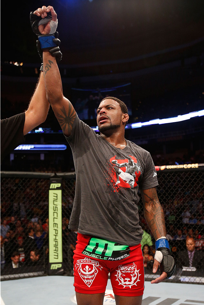 BOSTON, MA - AUGUST 17:   Michael Johnson reacts after his victory over Joe Lauzon in their UFC lightweight bout at TD Garden on August 17, 2013 in Boston, Massachusetts. (Photo by Josh Hedges/Zuffa LLC/Zuffa LLC via Getty Images)