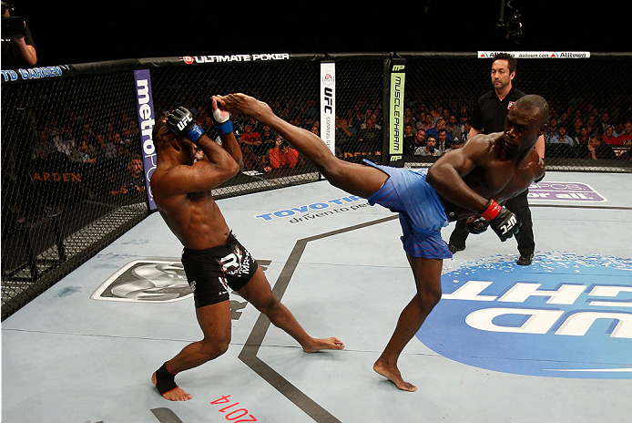 BOSTON, MA - AUGUST 17:  (R-L) Uriah Hall kicks John Howard in their UFC middleweight bout at TD Garden on August 17, 2013 in Boston, Massachusetts. (Photo by Josh Hedges/Zuffa LLC/Zuffa LLC via Getty Images)