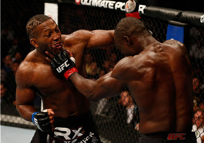 BOSTON, MA - AUGUST 17:  (L-R) John Howard punches Uriah Hall in their UFC middleweight bout at TD Garden on August 17, 2013 in Boston, Massachusetts. (Photo by Josh Hedges/Zuffa LLC/Zuffa LLC via Getty Images)