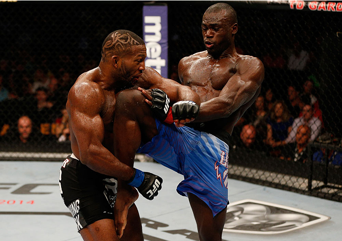 BOSTON, MA - AUGUST 17:  (R-L) Uriah Hall knees John Howard in their UFC middleweight bout at TD Garden on August 17, 2013 in Boston, Massachusetts. (Photo by Josh Hedges/Zuffa LLC/Zuffa LLC via Getty Images)