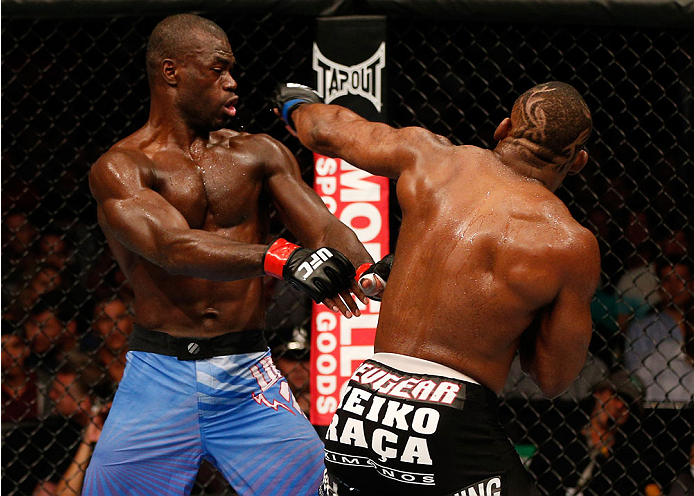 BOSTON, MA - AUGUST 17:  (R-L) John Howard punches Uriah Hall in their UFC middleweight bout at TD Garden on August 17, 2013 in Boston, Massachusetts. (Photo by Josh Hedges/Zuffa LLC/Zuffa LLC via Getty Images)