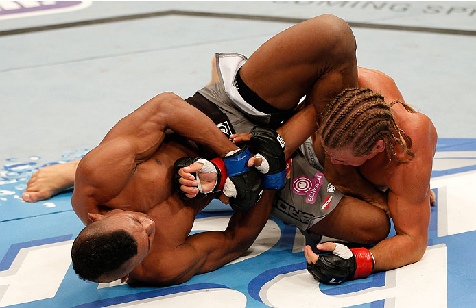 BOSTON, MA - AUGUST 17:  (L-R) Iuri Alcantara attempts an arm bar submission against Urijah Faber in their UFC bantamweight bout at TD Garden on August 17, 2013 in Boston, Massachusetts. (Photo by Josh Hedges/Zuffa LLC/Zuffa LLC via Getty Images)