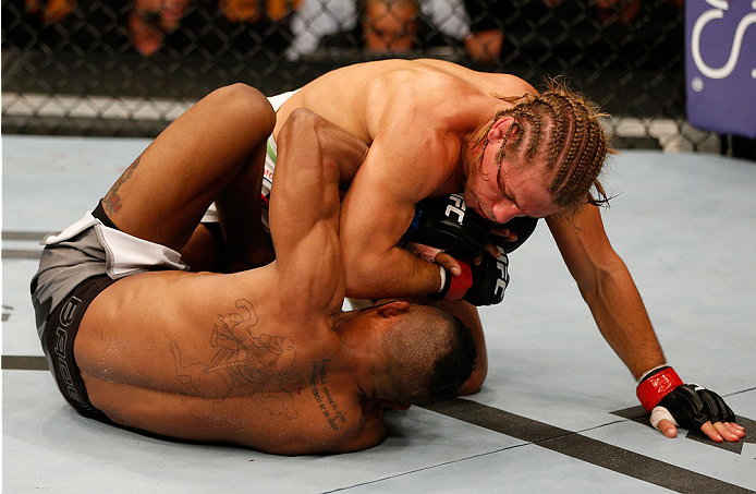 BOSTON, MA - AUGUST 17:  (R-L) Urijah Faber elbows Iuri Alcantara in their UFC bantamweight bout at TD Garden on August 17, 2013 in Boston, Massachusetts. (Photo by Josh Hedges/Zuffa LLC/Zuffa LLC via Getty Images)