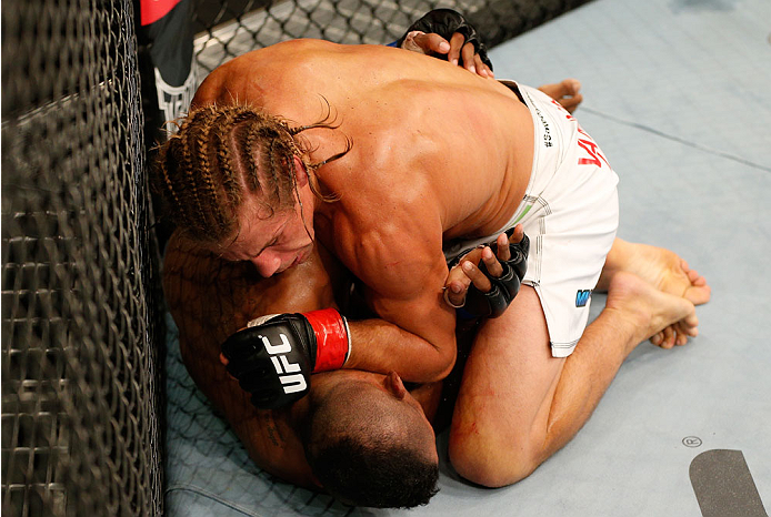 BOSTON, MA - AUGUST 17:  Urijah Faber (top) elbows Iuri Alcantara in their UFC bantamweight bout at TD Garden on August 17, 2013 in Boston, Massachusetts. (Photo by Josh Hedges/Zuffa LLC/Zuffa LLC via Getty Images)