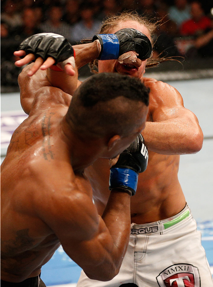 BOSTON, MA - AUGUST 17:  (L-R) Iuri Alcantara punches Urijah Faber in their UFC bantamweight bout at TD Garden on August 17, 2013 in Boston, Massachusetts. (Photo by Josh Hedges/Zuffa LLC/Zuffa LLC via Getty Images)