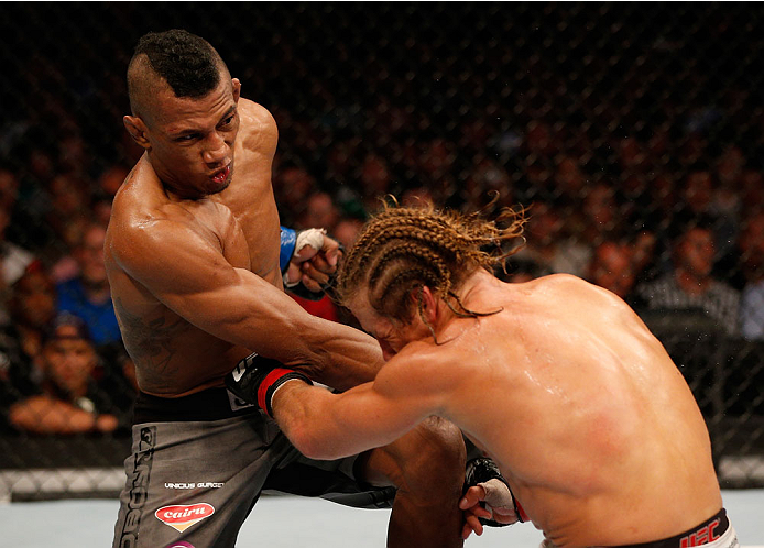 BOSTON, MA - AUGUST 17:  (L-R) Iuri Alcantara punches Urijah Faber in their UFC bantamweight bout at TD Garden on August 17, 2013 in Boston, Massachusetts. (Photo by Josh Hedges/Zuffa LLC/Zuffa LLC via Getty Images)