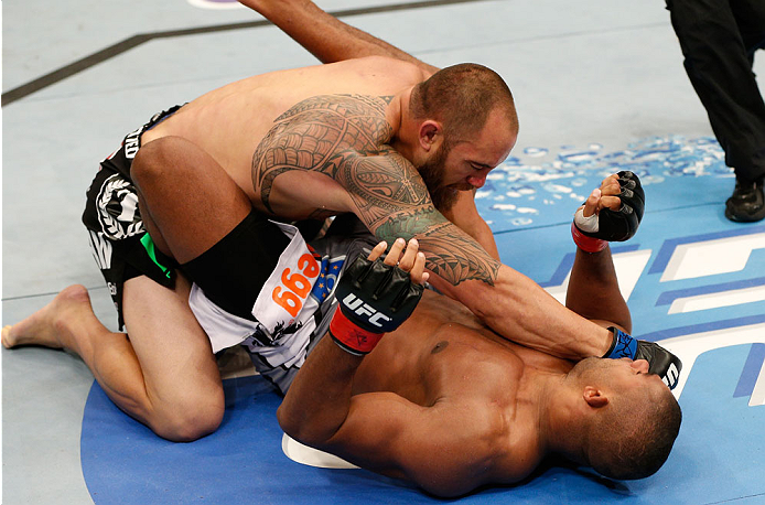 BOSTON, MA - AUGUST 17:  (L-R) Travis Browne knocks out Alistair Overeem with a series of punches in their UFC heavyweight bout at TD Garden on August 17, 2013 in Boston, Massachusetts. (Photo by Josh Hedges/Zuffa LLC/Zuffa LLC via Getty Images)