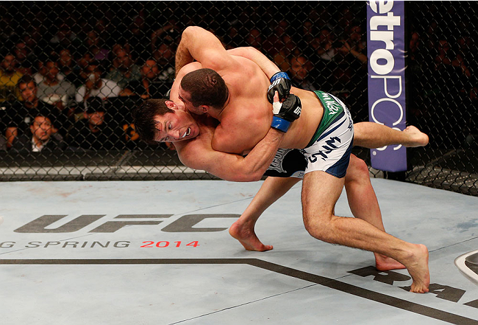 BOSTON, MA - AUGUST 17:  (L-R) Chael Sonnen takes down Mauricio "Shogun" Rua in their UFC light heavyweight bout at TD Garden on August 17, 2013 in Boston, Massachusetts. (Photo by Josh Hedges/Zuffa LLC/Zuffa LLC via Getty Images)