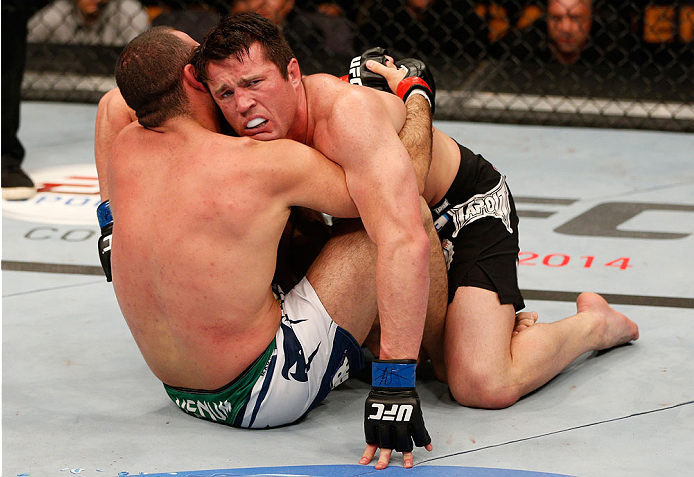 BOSTON, MA - AUGUST 17:  (R-L) Chael Sonnen and Mauricio "Shogun" Rua grapple for position on the ground in their UFC light heavyweight bout at TD Garden on August 17, 2013 in Boston, Massachusetts. (Photo by Josh Hedges/Zuffa LLC/Zuffa LLC via Getty Imag