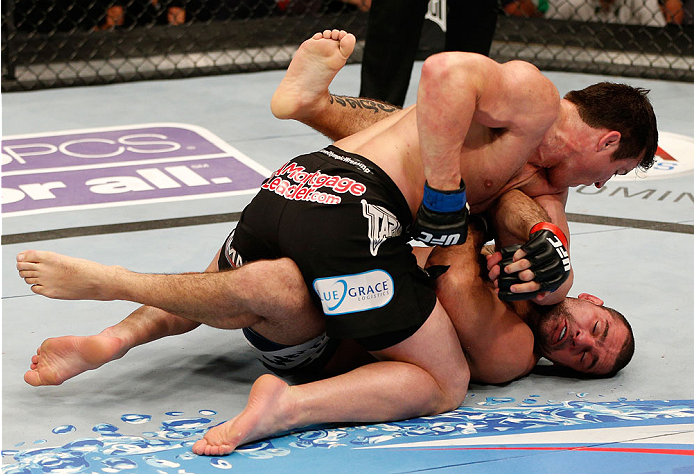 BOSTON, MA - AUGUST 17: (L-R) Chael Sonnen punches Mauricio "Shogun" Rua in their UFC light heavyweight bout at TD Garden on August 17, 2013 in Boston, Massachusetts. (Photo by Josh Hedges/Zuffa LLC/Zuffa LLC via Getty Images)