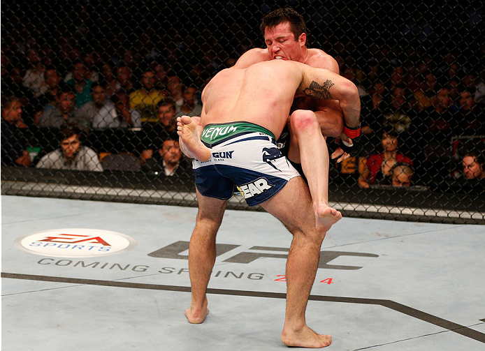 BOSTON, MA - AUGUST 17: (R-L) Chael Sonnen secures a guillotine choke submission against Mauricio "Shogun" Rua in their UFC light heavyweight bout at TD Garden on August 17, 2013 in Boston, Massachusetts. (Photo by Josh Hedges/Zuffa LLC/Zuffa LLC via Get