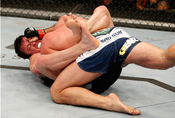 BOSTON, MA - AUGUST 17:  (L-R) Chael Sonnen secures a guillotine choke submission against Mauricio "Shogun" Rua in their UFC light heavyweight bout at TD Garden on August 17, 2013 in Boston, Massachusetts. (Photo by Josh Hedges/Zuffa LLC/Zuffa LLC via Get