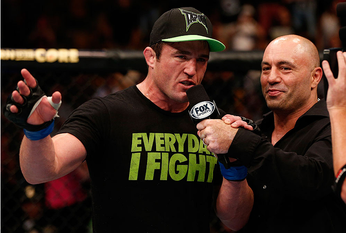 BOSTON, MA - AUGUST 17: Chael Sonnen is interviewed by Joe Rogan after his submission victory over Mauricio "Shogun" Rua in their UFC light heavyweight bout at TD Garden on August 17, 2013 in Boston, Massachusetts. (Photo by Josh Hedges/Zuffa LLC/Zuffa L