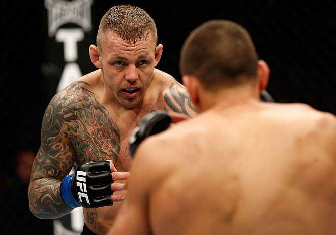 GOLD COAST, AUSTRALIA - DECEMBER 15:  (L-R) Ross Pearson squares off with George Sotiropoulos during their lightweight fight at the UFC on FX event on December 15, 2012  at Gold Coast Convention and Exhibition Centre in Gold Coast, Australia.  (Photo by J