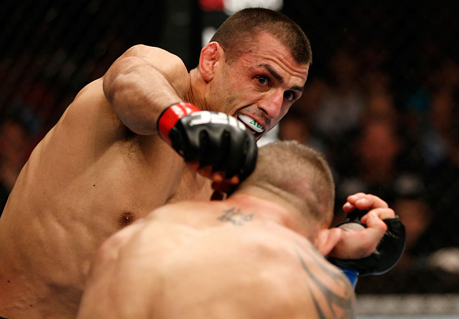 GOLD COAST, AUSTRALIA - DECEMBER 15:  (L-R) George Sotiropoulos punches Ross Pearson during their lightweight fight at the UFC on FX event on December 15, 2012  at Gold Coast Convention and Exhibition Centre in Gold Coast, Australia.  (Photo by Josh Hedge