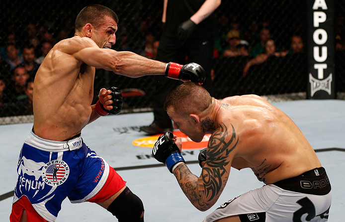 GOLD COAST, AUSTRALIA - DECEMBER 15:  (L-R) George Sotiropoulos punches Ross Pearson during their lightweight fight at the UFC on FX event on December 15, 2012  at Gold Coast Convention and Exhibition Centre in Gold Coast, Australia.  (Photo by Josh Hedge