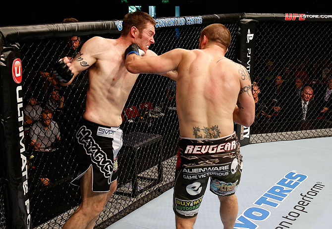GOLD COAST, AUSTRALIA - DECEMBER 15:  (R-L) Cody Donovan punches Nick Penner during their light heavyweight fight at the UFC on FX event on December 15, 2012  at Gold Coast Convention and Exhibition Centre in Gold Coast, Australia.  (Photo by Josh Hedges/