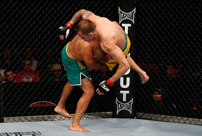 GOLD COAST, AUSTRALIA - DECEMBER 15:  (L-R) Manuel Rodriguez takes down Benny Alloway during their welterweight fight at the UFC on FX event on December 15, 2012  at Gold Coast Convention and Exhibition Centre in Gold Coast, Australia.  (Photo by Josh Hed