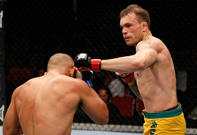 GOLD COAST, AUSTRALIA - DECEMBER 15:  (R-L) Benny Alloway punches Manuel Rodriguez during their welterweight fight at the UFC on FX event on December 15, 2012  at Gold Coast Convention and Exhibition Centre in Gold Coast, Australia.  (Photo by Josh Hedges
