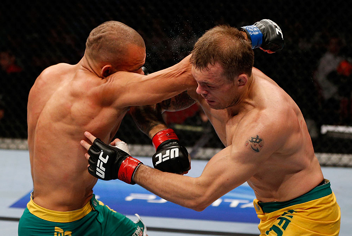 GOLD COAST, AUSTRALIA - DECEMBER 15:  (L-R) Manuel Rodriguez punches Benny Alloway during their welterweight fight at the UFC on FX event on December 15, 2012  at Gold Coast Convention and Exhibition Centre in Gold Coast, Australia.  (Photo by Josh Hedges