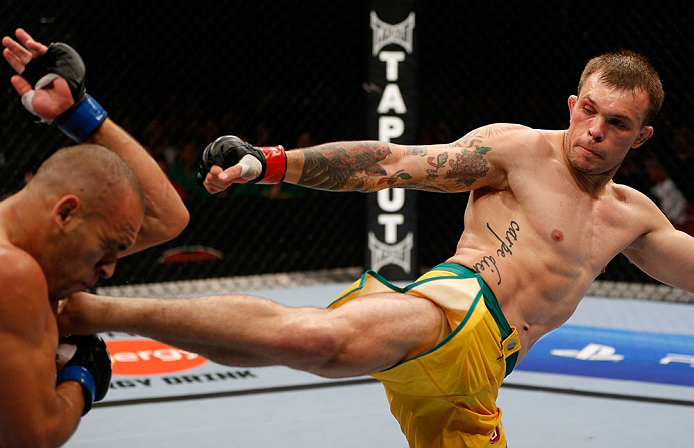GOLD COAST, AUSTRALIA - DECEMBER 15:  (R-L) Benny Alloway kicks Manuel Rodriguez during their welterweight fight at the UFC on FX event on December 15, 2012  at Gold Coast Convention and Exhibition Centre in Gold Coast, Australia.  (Photo by Josh Hedges/Z