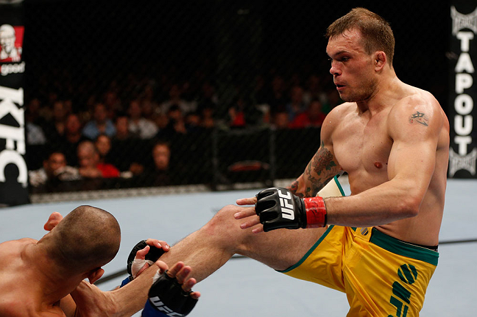 GOLD COAST, AUSTRALIA - DECEMBER 15:  (R-L) Benny Alloway kicks Manuel Rodriguez during their welterweight fight at the UFC on FX event on December 15, 2012  at Gold Coast Convention and Exhibition Centre in Gold Coast, Australia.  (Photo by Josh Hedges/Z