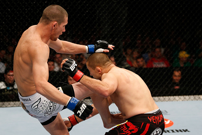 GOLD COAST, AUSTRALIA - DECEMBER 15:  (L-R) Seth Baczynski delivers a knee strike against Mike Pierce during their welterweight fight at the UFC on FX event on December 15, 2012  at Gold Coast Convention and Exhibition Centre in Gold Coast, Australia.  (P