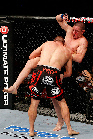 GOLD COAST, AUSTRALIA - DECEMBER 15:  (L-R) Mike Pierce takes down Seth Baczynski during their welterweight fight at the UFC on FX event on December 15, 2012  at Gold Coast Convention and Exhibition Centre in Gold Coast, Australia.  (Photo by Josh Hedges/