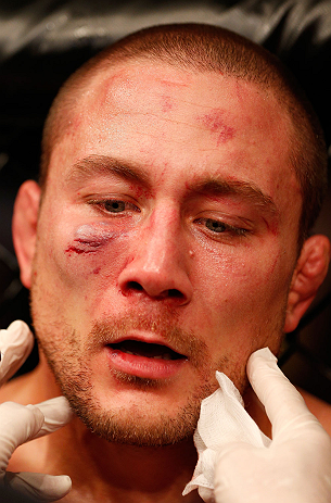 GOLD COAST, AUSTRALIA - DECEMBER 15:  Mike Pierce is examined by a doctor after his three-round welterweight bout against Seth Baczynski at the UFC on FX event on December 15, 2012  at Gold Coast Convention and Exhibition Centre in Gold Coast, Australia. 
