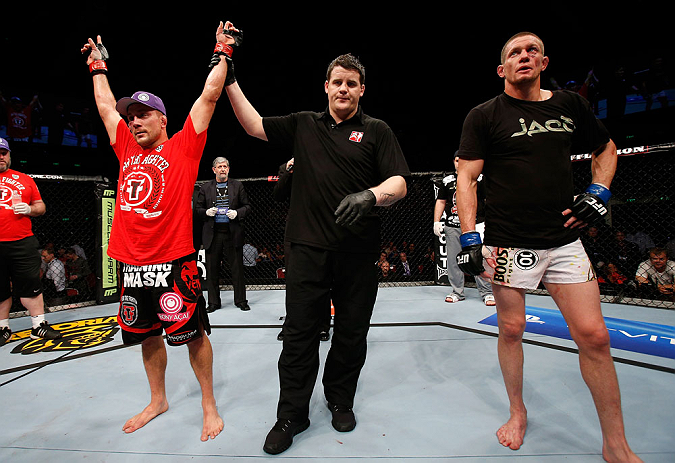 GOLD COAST, AUSTRALIA - DECEMBER 15:  Mike Pierce (L) reacts after defeating Seth Baczynski during their welterweight fight at the UFC on FX event on December 15, 2012  at Gold Coast Convention and Exhibition Centre in Gold Coast, Australia.  (Photo by Jo