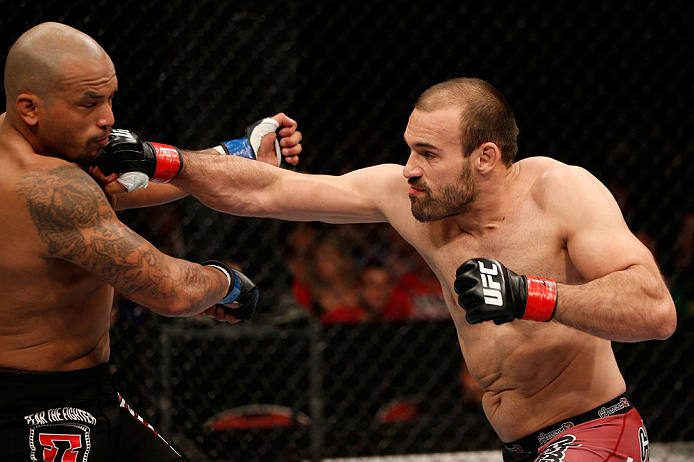 GOLD COAST, AUSTRALIA - DECEMBER 15:  (R-L) Igor Pokrajac punches Joey Beltran during their light heavyweight fight at the UFC on FX event on December 15, 2012  at Gold Coast Convention and Exhibition Centre in Gold Coast, Australia.  (Photo by Josh Hedge