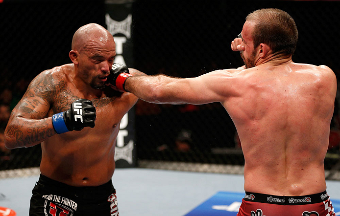 GOLD COAST, AUSTRALIA - DECEMBER 15:  (R-L) Igor Pokrajac punches Joey Beltran during their light heavyweight fight at the UFC on FX event on December 15, 2012  at Gold Coast Convention and Exhibition Centre in Gold Coast, Australia.  (Photo by Josh Hedge