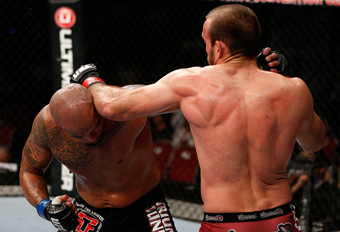GOLD COAST, AUSTRALIA - DECEMBER 15:  (R-L) Igor Pokrajac and Joey Beltran trade punches during their light heavyweight fight at the UFC on FX event on December 15, 2012  at Gold Coast Convention and Exhibition Centre in Gold Coast, Australia.  (Photo by 