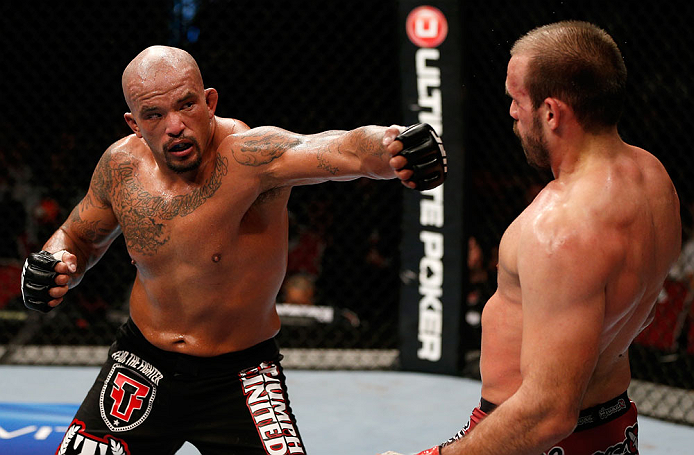 GOLD COAST, AUSTRALIA - DECEMBER 15:  (L-R) Joey Beltran punches Igor Pokrajac during their light heavyweight fight at the UFC on FX event on December 15, 2012  at Gold Coast Convention and Exhibition Centre in Gold Coast, Australia.  (Photo by Josh Hedge