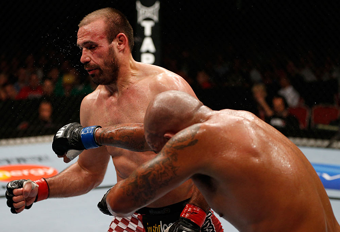 GOLD COAST, AUSTRALIA - DECEMBER 15:  (R-L) Joey Beltran punches Igor Pokrajac during their light heavyweight fight at the UFC on FX event on December 15, 2012  at Gold Coast Convention and Exhibition Centre in Gold Coast, Australia.  (Photo by Josh Hedge