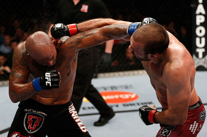 GOLD COAST, AUSTRALIA - DECEMBER 15:  (R-L) Igor Pokrajac and Joey Beltran trade punches during their light heavyweight fight at the UFC on FX event on December 15, 2012  at Gold Coast Convention and Exhibition Centre in Gold Coast, Australia.  (Photo by 