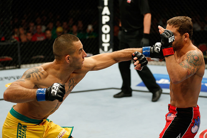 GOLD COAST, AUSTRALIA - DECEMBER 15:  (L-R) Yaotzin Meza punches Chad Mendes during their featherweight fight at the UFC on FX event on December 15, 2012  at Gold Coast Convention and Exhibition Centre in Gold Coast, Australia.  (Photo by Josh Hedges/Zuff